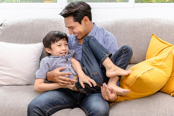 happy-asian-father-playing-carry-his-son-sofa-living-room-home-family-relationship-concept